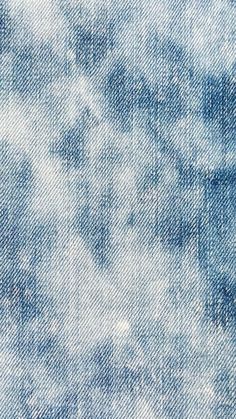 the texture of blue jeans with white spots