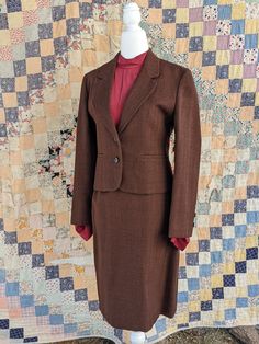 "Beautiful woman's tailored skirt and Blazer set. This 100% wool suit is in perfect condition.  Made in the USA Measurements taken flat  Jacket  Bust 17\"  Waist 16\" Torso 19\"  Shoulders 15½\" Sleeve length 22\"  Skirt  Length 22½\"  Waist 13\" Hips 18¼ \"" Professional Tailored Single Breasted Skirt Suit, Fitted Single Breasted Skirt Suit For Work, Fitted Single-breasted Skirt Suit For Work, Tailored Single-breasted Office Lady Skirt Suit, Fitted Business Skirt Suit With Suit Collar, Fitted Skirt Suit With Suit Collar For Business, Classic Notch Lapel Skirt Suit For Career, Fitted Single Breasted Skirt Suit For Office Wear, Fitted Single-breasted Skirt Suit For Office Wear