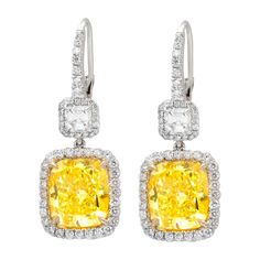 Platinum and 18kt yellow gold fancy yellow diamond earrings, features 10.76ct of two radiant diamonds fly-fy vs and 2.00ct of two ascher cuts diamonds and micropave rd diamonds all around. Yellow Diamond Earrings, Yellow Diamond Earring, Platinum Earrings, Fancy Yellow Diamond, Diamond Dangle Earrings, Yellow Earrings, Expensive Jewelry, Fancy Diamonds, White Gold Earrings