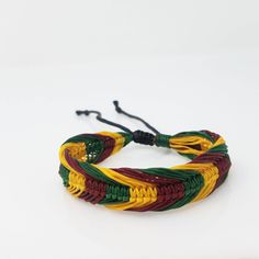 Handmade Rasta Bracelet with the colors of the Jamaican Flag This bracelet is Unisex Braided Bracelet Adjustable Cord - Fits Most Size Jamaican Style This beautiful bracelet is simply stunning. Our commitment to excellent quality ensures each piece is skillfully inspected.Order this today or browse our incredible selection of jewelry. FAST SHIPPING! Visit my Etsy Shop to see more Rasta Style Jewelry! Handmade Rasta Bracelets, Rasta Necklaces and Rasta Earrings. To visit my Etsy Shop Click here: Adjustable Multicolor Wristband Bracelet, Adjustable Multicolor Jubilee Bracelet, Adjustable Yellow Bangle For Gift, Adjustable Multicolor Braided Bangle Bracelets, Adjustable Multicolor Band Bracelets, Adjustable Multicolor Band Bracelet, Green Adjustable Braided Bangle Bracelet, Adjustable Red Band Bracelets, Rasta Bracelet