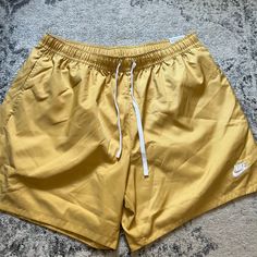 New With Tags Nike Standard Above The Knee Length Shorts. Gold Yellow Color With White Nike Logo. Mesh Lining. Size Xl. Awesome Shorts! Nike Summer Bottoms For Vacation, Nike Summer Vacation Bottoms, Nike Shorts For Summer Loungewear, Nike Summer Beach Bottoms, Sporty Nike Bottoms For Vacation, Nike Casual Vacation Bottoms, Nike Bottoms For Beach And Summer, Nike Beachwear Bottoms For Summer, Nike Summer Beachwear Bottoms