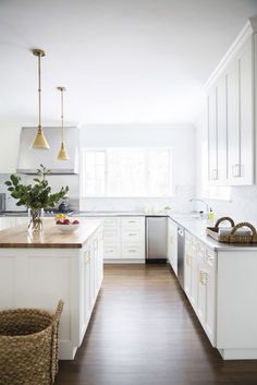 the kitchen is clean and ready for us to use it's white cabinetry