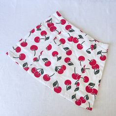 Cherry Print Mini Skirt Cherry print mini skirt made from deadstock cotton fabric.  Designed with panels to fit your curves perfectly. Matching corset available. None stretch thick cotton fabric. Invisible zip at the back. Length 16 inches as standard(can be altered at no extra cost) Lined for comfort Lovingly designed and artisan made in our Brighton Studio. Sizing: We offer a made to measure service or you can use our standard sizes as shown below. UK 8   - Waist 26 inches/ Hip 34 inches UK 10 Y2k Style Stretch Cotton Skort, Y2k Mini Cotton Skort, Y2k Style Cotton Stretch Skirt, Y2k Style Stretch Cotton Skirt, Fitted Retro Style Mini Skirt, Fitted Printed Mini Skirt For Summer, Fitted Cotton Mini Skirt For Summer, Retro Cotton Mini Skirt, Retro Fitted Mini Skirt For Summer