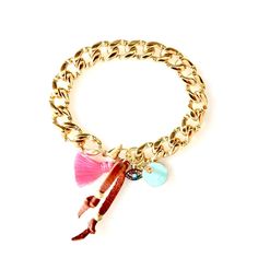 Handcrafted chunky gold plated cuban link chain bracelet with a large lobster clasp, a tiny evil eye charm, a turquoise charm, a silk tassel and a cognac color leather tie with gold danglers. Wear this gorgeous bracelet alone or stacked with your other bracelets for a super stylish and chic summery look. Bracelet measures 6.5 inches Custom sizes available Made with love in Los Angeles Complimentary gift wrapping provided All sales final Trendy Beach Jewelry With Charms, Chic Metal Jewelry With Charms, Chic Metal Charm Jewelry, Trendy Jewelry With Charms, Bohemian Chain Charm Bracelet As Gift, Bohemian Gold Charm Bracelet With Lobster Clasp, Bohemian Charm Bracelet Chain As Gift, Bohemian Gold Charm Bracelet With Adjustable Chain, Chic Bracelet With Adjustable Chain