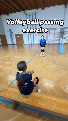 a group of young children sitting on top of a wooden bench in a gym with the words volleyball passing exercise