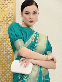 Turquoise blue and gold-toned banarasi sareeFloral woven design saree with woven design borderHas zari detailThe model is wearing a stitched version of the blouse piece. The saree comes with an unstitched blouse piece Western Kurtis, Saree Floral, Banarsi Saree, Saree Sale, Design Saree, Banarasi Saree, Woven Design, New Launch, Banarasi Sarees