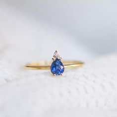 A 14K gold ring with a natural sapphire gemstone pear cut and a diamond brilliant cut in white gold or in yellow gold. A perfect engagement gold ring for women, stacking and delicate that adds glam to every outfit. Sapphire is the birthstone of September. 100% handcrafted with love!D E T A I L S● Metal: 14K solid white gold, 14K gold, 14K rose gold● Gemstones: Sapphire, Diamond● Gemstones weight: Sapphire 0.4ct, Diamond 0.02ct● Sapphire dimensions: 5.4 x 4.2 mmR I N G ∙ S I Z I N GFor General Re Fine Jewelry Sapphire Ring With Pear Shape, Yellow Gold Teardrop Sapphire Ring Fine Jewelry, Teardrop Sapphire Ring In Yellow Gold, Teardrop Yellow Gold Sapphire Ring, Fine Jewelry Pear-shaped Sapphire Ring, Teardrop Sapphire Ring Fine Jewelry, Pear-shaped Sapphire Ring In 14k Gold, Pear-shaped Sapphire Ring, Teardrop Sapphire Ring In Yellow Gold For Anniversary