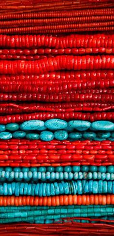 colorful beads are stacked on top of each other