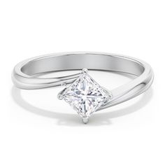 a white gold ring with a princess cut diamond in the center and a thin band around it