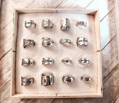 there are many rings in a box on the floor