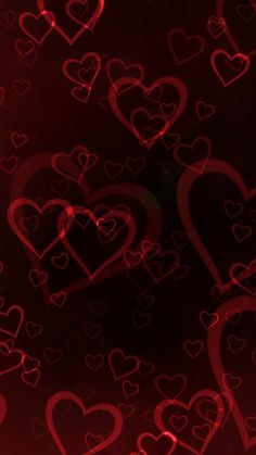 many red hearts are arranged in the shape of heart shapes on a black and red background