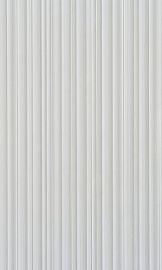 a white wall with vertical lines painted on it