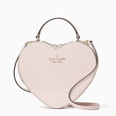 This is for a Brand New in Original Packaging and with Tags 100% Authentic Kate Spade New York Love Shack Heart Purse (Style #wkr00339) in Chalk Pink. This crossbody is perfect if you want to carry your important things without all the bulk.  Plus, your hands are free to keep up with all your group texts and grip that vanilla latte. Saffiano PVC Two-way Spade jacquard lining KSNY metal pinmount logo Crossbody with zip around closure Six credit card slots Interior front slip pocket 7.5"h x 8.25"w x 2.375"d Handle drop:  2.5" Strap drop:  22" Dust bag not included Imported Please see our other items for combined shipping.  Thank you. Cute Pink Purse, Kate Spade Bag Aesthetic, Kate Spade Purse Aesthetic, Kate Spade Heart Purse, Kate Spade Heart Bag, Kate Spade Pink Purse, Pink Kate Spade Bag, Pink Purses, Kate Spade Bag Pink