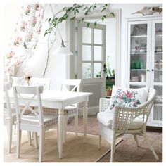 a white table and chairs in a room