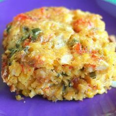 a close up of food on a plate with words in the background that reads mardi gras crawfish cornbread