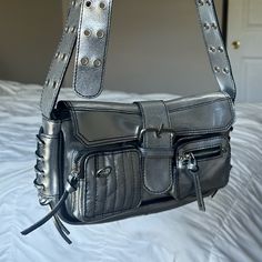 This Is A Perfect Purse For A Night Out, Dinner, Etc. It Holds A Lot Of Items And Has An Adjustable Strap. This Is A Very Unique Piece From A High-Quality Brand. Daily Use Crossbody Shoulder Bag With Silver-tone Hardware, Daily Use Shoulder Bag With Silver-tone Hardware, Travel Shoulder Bag With Silver-tone Hardware, Rectangular Shoulder Bag With Metal Hardware For On-the-go, Everyday Flap Shoulder Bag With Metal Hardware, Everyday Shoulder Bag With Silver-tone Hardware, Everyday Double Handle Baguette Bag With Metal Hardware, Everyday Use Satchel Baguette Bag With Silver-tone Hardware, Everyday Satchel Baguette Bag With Silver-tone Hardware