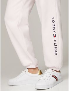 Tommy Hilfiger women's pant. Ideal for year-round wear, our medium weight sweatpants are made from cotton-blend fleece that feels soft against the skin. Designed with slash side pockets, an elastic waistband with an internal drawstring, and elastic cuffs, this sporty pair is made complete with our embroidered logo at the leg.  Material: 70% Better Cotton Initiative (bci) Cotton, 30% Polyester. Sporty Spring Joggers For Elevated Casual Wear, Casual Jogging Sweatpants With Logo, White Casual Bottoms With Logo Detail, Casual White Bottoms With Logo Detail, Casual Bottoms With Embroidered Logo For Loungewear, Sporty Sweatpants For Elevated Casual Spring, Sporty White Joggers For Fall, Trendy White Jogging Bottoms, Trendy White Joggers For Jogging