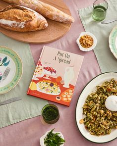 a table topped with plates and bowls filled with food