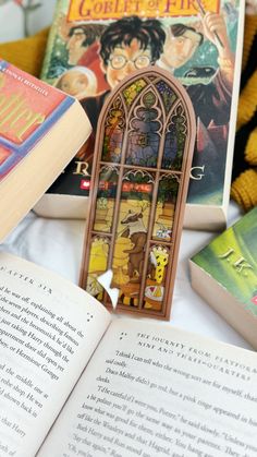 an open book sitting on top of a table next to stuffed animals and other books