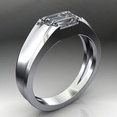 A classic men's band in your choice of metal, but with a modern twist - a conflict-free 1.75 carat NEO moissanite center stone. Band measures 6mm wide at the top and narrows a bit down to 3.3mm at the base of the shank.Available in 14k white, yellow or rose gold, and also platinum. Make your selection to the right to see pricing on the various metals.Check out the Cash, live and in the flesh. ;)https://www.instagram.com/p/BbR_wC4hPzC/[[----- GEMSTONE DETAILS -----]]One 1.75 carat 8x6mm colorless Formal Emerald Cut Emerald Ring With Tension Setting, Modern Gia Certified Emerald Cut Diamond Ring, Gia Certified Modern Emerald Cut Ring, Modern Gia Certified Emerald Cut Ring, Modern Mens Wedding Bands, Mens Wedding Bands White Gold, Mens Gold Wedding Band, Rings Ceremony, The Flesh