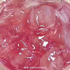 a bowl filled with ice and water on top of a table