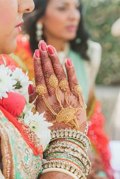 the bride is holding her hands together