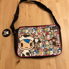 Nwt Tokidoki Messenger Bag Featuring Mozzarella And Friends (Aka, The Moofia!) *Tokidoki Messenger Bag *One Main Zipped Compartment, Adjustable Shoulder Strap *Inside Pocket For Valuables *Matte Black Pu Fabric With An All-Over Tokidoki Print On The Front *Approx Dimensions: 39.8 X 26.4 X 3.4 Cm Multicolor Kawaii Shoulder Bag For Everyday Use, Kawaii Multicolor Shoulder Bag For Everyday Use, Playful Satchel Shoulder Bag For School, Cute Multicolor Travel Satchel, Fun Black Bags For Back To School, Kawaii Multicolor Bags For Everyday Use, Kawaii Multicolor Bags For Back To School, Cute Multicolor Satchel With Adjustable Strap, Harajuku Style Multicolor Shoulder Bag For School