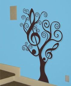 a tree with musical notes on it in the corner of a room