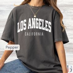 Los Angeles T-Shirt, West Coast Comfort Colors Unisex Shirt, Vintage LA College Style Tee, Oversized, Tshirt, Retro Los Angeles California  Step into the sun-soaked streets of LA with our "Los Angeles, California" Comfort Colors 1717 garment-dyed t-shirt. Designed with a vintage feel and bold college block text, this premium tee is perfect for capturing the timeless, cool, and laid-back style of the City of Angels. 🎁 This vintage 'Los Angeles, California' tee makes a great gift for LA natives, Oversized Screen Print T-shirt For College, Oversized Graphic Print T-shirt For College, Trendy Oversized Pre-shrunk Shirt, Oversized Gray Slogan Tops, Oversized Gray Tops With Slogan, Relaxed Fit Graphic Tee For College, Oversized Tops With Letter Print, Oversized Slogan T-shirt For College, Gray Oversized Slogan T-shirt