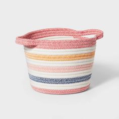 a multicolored striped basket on a white background