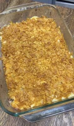 a casserole dish is sitting on a wooden table