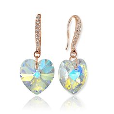 These stunning earrings for women and teen girls feature heart shaped designs created with Swarovski crystals in a gorgeous Aurora Borealis color, a must-have for any jewelry collection. These beautiful earrings are secured with fishhooks that are encrusted with round cubic zirconia stones, for an extra dazzle. The earrings are crafted of fine rose gold flashed sterling silver, and are nickel free. Product Details Metal Type rose-gold-flashed-silver Metal Stamp 925-sterling Weight 3.9GR Length 3 Crystal Heart Drop Earrings For Anniversary, Crystal Heart-shaped Earrings For Pierced Ears, Heart Cut Crystal Earrings, Heart-shaped Crystal Earrings For Anniversary, Crystal Heart Earrings, Turquoise Heart, Heart Dangle Earrings, Heart Drop Earrings, Leverback Earrings