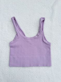 ☀Features: It is stretchy fits sizes XS-L ☀Details: Fabric: 92% Nylon / 8% Spandex Made in USA Purple Seamless Sporty Top, High Stretch Seamless Purple Tops, Casual Seamless Crop Top For Yoga, Casual Seamless Summer Tops, Summer Seamless Fabric Yoga Tops, Casual Summer Tops In Seamless Fabric, Purple Seamless Tops For Gym, Purple Stretch Crop Top, Purple Sleeveless Top With Medium Support