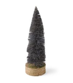 a small christmas tree sitting on top of a burlock covered base in front of a white background