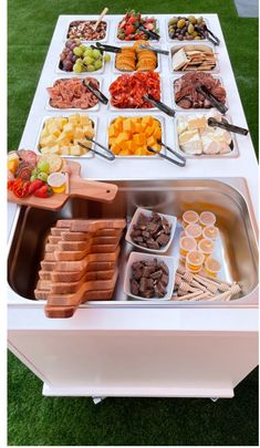 a buffet table filled with different types of food