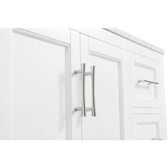 a white cabinet with two doors and some handles on the door handle is shown in this image