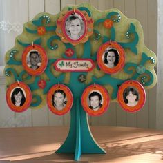 the family tree is decorated with pictures of people in different colors and shapes, as well as oval frames