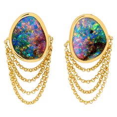 "La Vida Dulce” opal earrings seduce with vibrant colours and the alluring sway of delicate gold chains. Boulder opals (8.21ct) are set in 18K yellow gold – the host rock peeping through adds to the rawness of the piece and gives it an edge. A cheeky flirtation between the Renaissance and the Baroque; this is the perfect gift for the playful fashionista. Designed by Renata Bernard. The gemstones at the centre of these opal earrings are Australian boulder opals from Winton opal fields in Queensland, Australia. Their distinctive quality is their "play of colour," a phenomenon which manifests in opals' colours shifting and changing as the gems move. Australian opals, in general, are the quality benchmark in the world family of opals for their durability and beauty. These particular opals disp Boulder Opal Jewelry, Australian Opal Pendant, Ammolite Jewelry, Vintage Stud Earrings, Black Opal Ring, Gold For Sale, Opal Pendant Necklace, Sparkly Jewelry, Opal Earrings Stud