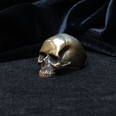 This is a Bronze Skull ring cast from an original sculpture created by me. I have size 9,10,11 and 11 1/2 in stock. Unique Adjustable Hand Cast Skull Ring, Symbolic Hand Cast Skull Ring, Hand Cast Skull Ring Gift, Unique Collectible Skull Rings, Hand Cast Skull Ring For Gift, Vintage Hand Cast Skull Ring As Gift, Hand-cast Skull Ring For Gift, Vintage Hand-cast Skull Ring For Gift, Collectible Hand Cast Skull Rings