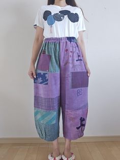 https://antiqueshopjunna.etsy.com Thank you for viewing. I made pants by dyeing tenugui cloth. Size: Pants length 90cm, elastic waist circumference - 110cm, hip circumference 118cm, rise 40.5cm, inseam 55cm, hem circumference 46cm, partially elastic hem. 100% cotton, no lining. 1 pocket Shipping: Items are shipped via International e-packet light. (Include Tracking) Delivery will take an AVERAGE of 2~3weeks. Caution: Import duties, taxes, and charges are not included in the item price or shipping cost. These changes are the buyer's responsibility. Please check with your country's customs office to determine what these additional costs will be prior to buying. Bohemian Cotton Bottoms With Collage Stitching, Purple Cotton Patchwork Bottoms, Purple Patchwork Cotton Bottoms, Kimono Remake, Patchwork Pants, Womens Jumpsuits, Waist Circumference, Pants Length, Jumpsuits For Women