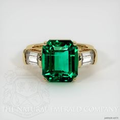 Luxury Octagon Emerald Ring, Luxury Yellow Gold Emerald Ring With Prong Setting, Luxury Emerald-cut Birthstone Ring As A Gift, Luxury Modern Octagon Emerald Ring, Luxury Yellow Gold Emerald Ring With Gemstone Accents, Luxury Yellow Gold Emerald-cut Crystal Ring, Luxury Green Baguette Cut Emerald Ring, Octagon Green Emerald Ring, Green Octagon Emerald Ring