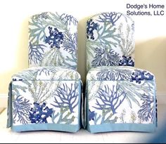 two blue and white chairs sitting next to each other