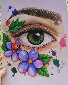 a drawing of an eye with flowers and ladybug on the outside of it