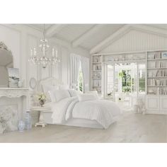 a bedroom with white furniture and a chandelier