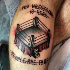 a man with a tattoo on his leg that says, pro wrestling is real people are fake