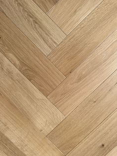 an image of wood flooring that looks like herringbones