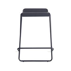 the backless stool is black and has a metal frame, with an open seat