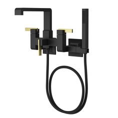 a black and gold shower faucet with two handset spigots, one hand held by a hose