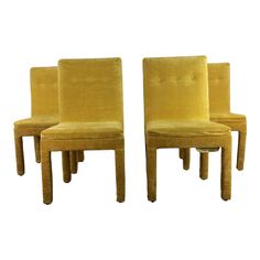 a pair of yellow chairs sitting next to each other