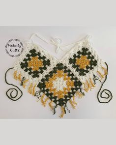 This playful granny square crop top with tassels is perfect fit for beach, festival or any hot summer day!  Colours: green, yellow, white. Material: cotton yarn. Straps: adjustable. Breast support: none. Size: UK 8 - UK 12. (Cup size up to DD) Hand made in a smoke free and pet free environment. Please note colours may vary do to your screen settings. Bohemian Green Crochet Crop Top, Green Crochet Lace Crop Top For Summer, Green Cropped Crochet Top For Summer, Green Crochet Summer Crop Top, White Crochet Top With Granny Square For Beach, White Crochet Top With Granny Square For Vacation, White Bohemian Halter Top With Crochet Lace, Green Bohemian Halter Top For Beach Season, Handmade White Halter Top For Festival